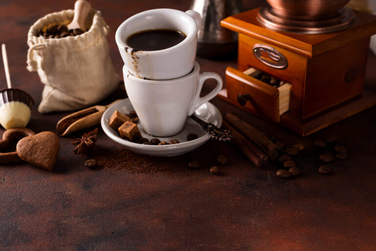 cup-of-steaming-hot-coffee-with-coffee-beans-coffe-PCYENJV.jpg