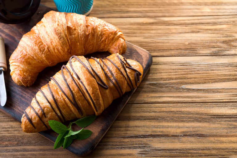 two-croissants-on-the-street-in-croissant-cafe-ins-VU7FZ3L.jpg